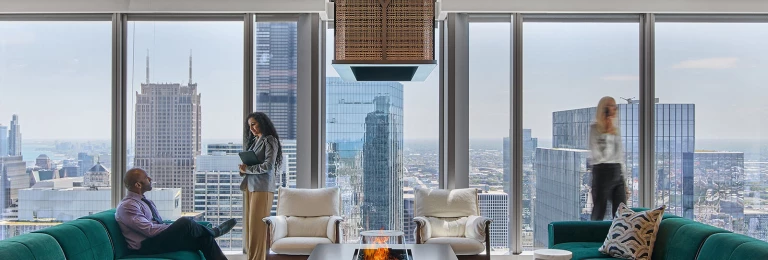 Banker SJD-21 Woven Wire Mesh reflecting natural light in the office space while adding detail and texture as a centerpiece above the fireplace.